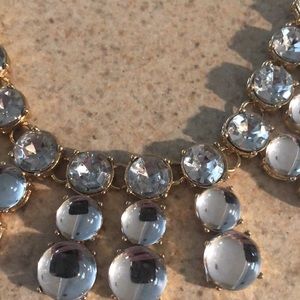 Stunning rhinestone & clear bubble stones adorn this gold necklace. Never worn